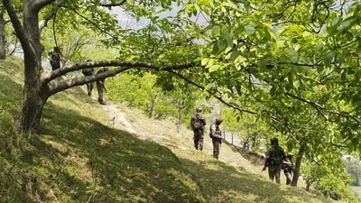 Security personnel keep vigil after a brief exchange of fire took place between terrorists and security forces in Lasana village of Surankote. (PTI FILE )