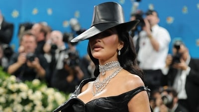 Kim Kardashian wore a matching hat with a western theme to lend an edgier twist to her leather look. (Getty Images via AFP)