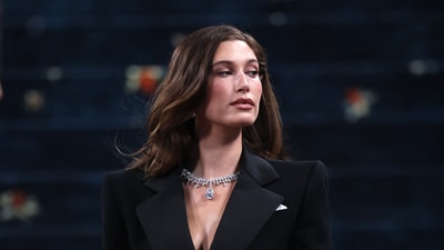 As Hailey Bieber, 28, ascended the stairs to the Metropolitan Museum of Art, she embraced the fashion event's theme, "Superfine: Tailoring Black Style," with her menswear ensemble, which featured a small pocket square and muscular shoulders. (REUTERS)