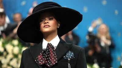 On the Met Gala carpet, Rihanna stole the spotlight in a gray Marc Jacobs bustier that accentuated her expanding baby bulge. She completed the ensemble with a striking wide-brimmed hat designed by milliner Stephen Jones. (REUTERS)