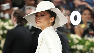 A matching face-covering hat completed Zendaya's stylish, all-white Louis Vuitton three-piece.&nbsp; (REUTERS)