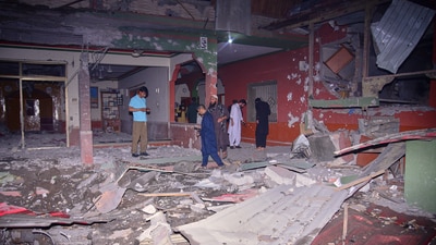 Local residents and members of media examine a building damaged by a missile strike near Muzaffarabad in Pakistan-controlled Kashmir, on Wednesday, May 7. (AP) Local residents and members of media examine a building damaged by a missile strike near Muzaffarabad in Pakistan-controlled Kashmir, on Wednesday, May 7. (AP)