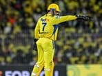 Chennai Super Kings' captain MS Dhoni adjusts the field during the Indian Premier League (IPL) Twenty20 cricket match between Chennai Super Kings and Punjab Kings