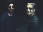 Diljit Dosanjh and Jackson Wang in stills from their new song Buck. Diljit Dosanjh and Jackson Wang in stills from their new song Buck.