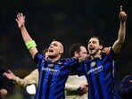 Lautaro Martinez (L) and Inter Milan's Italian defender Matteo Darmian celebrate after Inter Milan won the UEFA Champions League semi-final second leg football match between Inter Milan and FC Barcelona