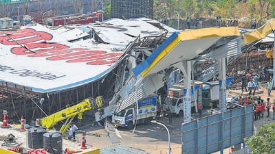 Mumbai, India - May 14, 2024: The NDRF and the fire brigade rescued injured people from underneath the collapsed billboard in the Cheda Nagar area of Ghatkopar, Mumbai, following heavy rain and strong winds. The incident resulted in the loss of fourteen lives and left 75 others injured. (Photo by Raju Shinde/HT Photo) Mumbai, India - May 14, 2024: The NDRF and the fire brigade rescued injured people from underneath the collapsed billboard in the Cheda Nagar area of Ghatkopar, Mumbai, following heavy rain and strong winds. The incident resulted in the loss of fourteen lives and left 75 others injured. (Photo by Raju Shinde/HT Photo)