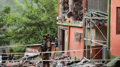 Army soldiers stand guard at a mosque building damaged by an Indian missile attack near Muzaffarabad. India's army said the operation was named 'Sindoor' in a reference to the women who saw their husbands killed in front of them in Pahalgam (AP)