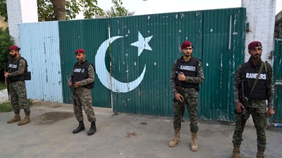 Pakistani paramilitary stand guard outside a gate of a complex close to the site of an Indian missile attack, in Muridke. Operation Sindoor was India's response to the Pahalgam terror attack. (AP)