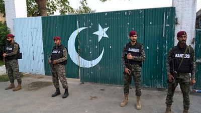 Pakistani paramilitary stand guard outside a gate of a complex close to the site of a suspected Indian missile attack, in Muridke, a town in Pakistan's Punjab province, Wednesday, May 7, 2025. (AP Photo/K.M. Chaudary) (AP) Pakistani paramilitary stand guard outside a gate of a complex close to the site of a suspected Indian missile attack, in Muridke, a town in Pakistan's Punjab province, Wednesday, May 7, 2025. (AP Photo/K.M. Chaudary) (AP)