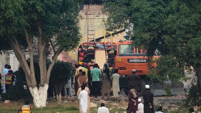 Rescue workers recover a body from a damaged building at the site of a Indian missile attack, in Muridke, Pakistan. The nine targets struck under 'Operation Sindoor', four in Pakistan and five in Pakistan-occupied-Kashmir, were chosen by the IAF after receiving intelligence inputs about terror camps operating under the guise of health centres to evade detection. (AP)