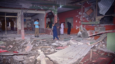 Local residents and members of media examine a building damaged by a missile strike near Muzaffarabad in Pakistan-occupied-Kashmir, on Wednesday, May 7. (AP) Local residents and members of media examine a building damaged by a missile strike near Muzaffarabad in Pakistan-occupied-Kashmir, on Wednesday, May 7. (AP)
