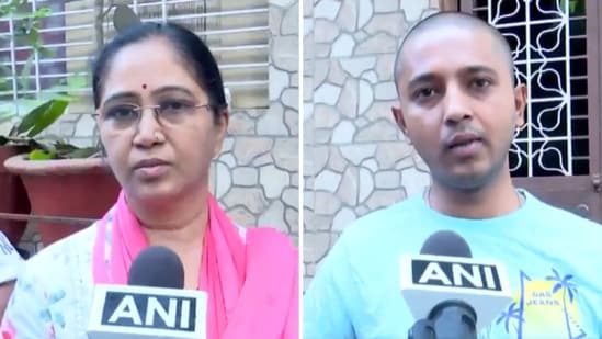 Wife and son of Kaustubh Ganbote, who was killed in the Pahalgam terror attack. (X/@ANI)