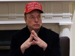 Tesla CEO Elon Musk wears a 'Trump Was Right About Everything!' hat while attending a cabinet meeting at the White House, in Washington, D.C., U.S., March 24, 2025. REUTERS/Carlos Barria/File Photo