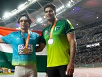 Neeraj Chopra and Arshad Nadeem pose for a photo. Neeraj Chopra and Arshad Nadeem pose for a photo.