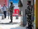 Indian paramilitary personnel stand guard along a roadside at the Lal Chowk in Srinagar on May 8. Indian paramilitary personnel stand guard along a roadside at the Lal Chowk in Srinagar on May 8.