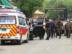 Security personnel cordon off a street near a site after an alleged drone was shot down in Lahore on May 8, 2025.