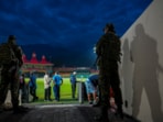 Security personnel stand guard a the HPCA Stadium in Dharamsala Security personnel stand guard a the HPCA Stadium in Dharamsala