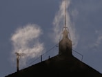 White smoke rises from the chimney on the Sistine Chapel, indicating that a new pope has been elected at the Vatican