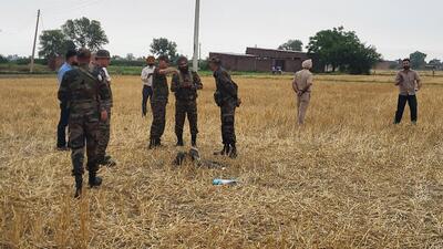 Army personnel inspecting the missile shell that landed at Makhan Windi village in Amritsar on Thursday. (Sameer Sehgal/HT) Army personnel inspecting the missile shell that landed at Makhan Windi village in Amritsar on Thursday. (Sameer Sehgal/HT)