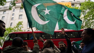 Demonstrators wave Pakistan's flags as they gather to protest outside the India High Commission, in London. (AP) Demonstrators wave Pakistan's flags as they gather to protest outside the India High Commission, in London. (AP)