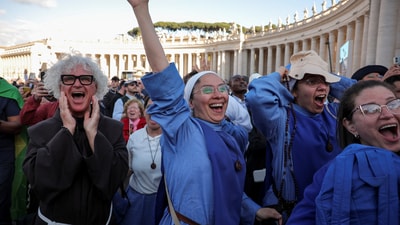 Nuns react to white smoke from the chimney on the Sistine Chapel, indicating that a new pope has been elected, at the Vatican, May 8, 2025. REUTERS/Marko Djurica (REUTERS)