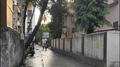Road number six is currently 4.5 metres wide. The BMC is widening it to nine metres, which threatens several buildings along the road, said residents Road number six is currently 4.5 metres wide. The BMC is widening it to nine metres, which threatens several buildings along the road, said residents