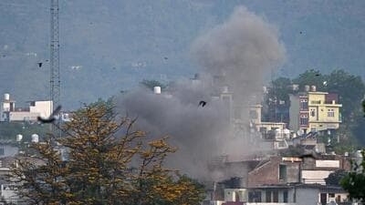 Smoke billows after an artillery shell fired by Pakistan landed in Kashmir’s Poonch district on May 7. (AFP Photo) Smoke billows after an artillery shell fired by Pakistan landed in Kashmir’s Poonch district on May 7. (AFP Photo)