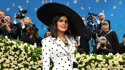 Black and white has never been so stylish. With an open hat and an equally gorgeous emerald necklace, Priyanka Chopra completed her polka-dotted attire. (AFP)
