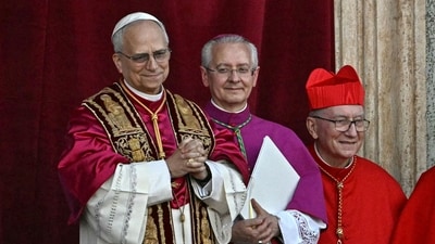 Newly elected Pope Leo XIV, Robert Prevost (L) gestures as he arrives on the main central loggia balcony of the St Peter's Basilica for the first time, after the cardinals ended the conclave, in The Vatican, on May 8, 2025. Robert Francis Prevost was on Thursday elected the first pope from the United States, the Vatican announced. A moderate who was close to Pope Francis and spent years as a missionary in Peru, he becomes the Catholic Church's 267th pontiff, taking the papal name Leo XIV. (Photo by Gabriel BOUYS / AFP) (AFP) Newly elected Pope Leo XIV, Robert Prevost (L) gestures as he arrives on the main central loggia balcony of the St Peter's Basilica for the first time, after the cardinals ended the conclave, in The Vatican, on May 8, 2025. Robert Francis Prevost was on Thursday elected the first pope from the United States, the Vatican announced. A moderate who was close to Pope Francis and spent years as a missionary in Peru, he becomes the Catholic Church's 267th pontiff, taking the papal name Leo XIV. (Photo by Gabriel BOUYS / AFP) (AFP)