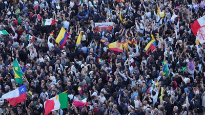 People cheers after the white smoke billowed from the chimney of the Sistine Chapel where 133 cardinals gathered on the second day of the conclave to elect a successor to late Pope Francis, at the Vatican, Thursday, May 8, 2025 (AP Photo/Markus Schreiber) (AP) People cheers after the white smoke billowed from the chimney of the Sistine Chapel where 133 cardinals gathered on the second day of the conclave to elect a successor to late Pope Francis, at the Vatican, Thursday, May 8, 2025 (AP Photo/Markus Schreiber) (AP)