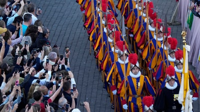 Vatican Swiss guards march in St Peter's Square after white smoke billowed from the chimney of the Sistine Chapel where 133 cardinals are gathering on the second day of the conclave to elect a successor to late Pope Francis, at the Vatican, Thursday, May 8, 2025. (AP Photo/Luca Bruno) (AP) Vatican Swiss guards march in St Peter's Square after white smoke billowed from the chimney of the Sistine Chapel where 133 cardinals are gathering on the second day of the conclave to elect a successor to late Pope Francis, at the Vatican, Thursday, May 8, 2025. (AP Photo/Luca Bruno) (AP)