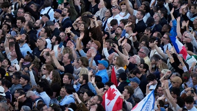 People cheer as a media drone flies over them in St Peter's Square after white smoke billowed from the chimney of the Sistine Chapel where 133 cardinals are gathering on the second day of the conclave to elect a successor to late Pope Francis, at the Vatican, Thursday, May 8, 2025. (AP Photo/Luca Bruno) (AP) People cheer as a media drone flies over them in St Peter's Square after white smoke billowed from the chimney of the Sistine Chapel where 133 cardinals are gathering on the second day of the conclave to elect a successor to late Pope Francis, at the Vatican, Thursday, May 8, 2025. (AP Photo/Luca Bruno) (AP)