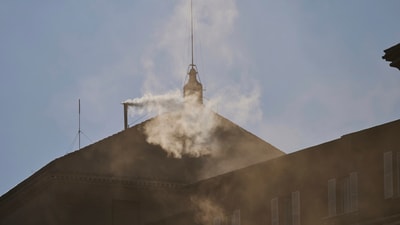 White smoke billows from the chimney of the Sistine Chapel where 133 cardinals are gathering on the second day of the conclave to elect a successor to late Pope Francis, at the Vatican, Thursday, May 8, 2025 (AP Photo/Bernat Armangue) (AP) White smoke billows from the chimney of the Sistine Chapel where 133 cardinals are gathering on the second day of the conclave to elect a successor to late Pope Francis, at the Vatican, Thursday, May 8, 2025 (AP Photo/Bernat Armangue) (AP)