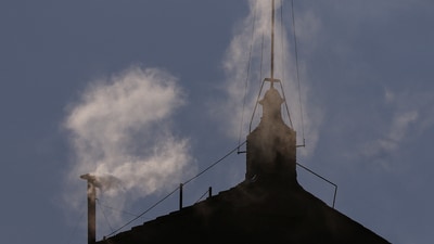 White smoke rises from the chimney on the Sistine Chapel, indicating that a new pope has been elected at the Vatican (REUTERS)