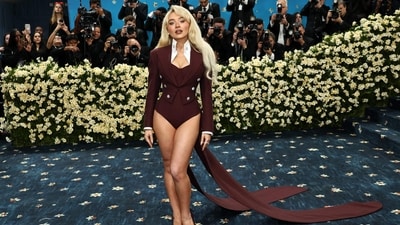 Sabrina Carpenter’s Louis Vuitton bodysuit had a flirty twist as she opted to go pants-free. However, this was more of a designer-driven choice, as she revealed in an interview with a Met Gala host that her short height was behind the no-pants look. But it can be labelled weird because despite the office siren energy, it looks incomplete. It's reminiscent of Zoom and Gmeet calls from the pandemic era. (Getty Images via AFP)