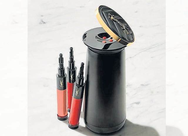 YSL’s Rouge Sur Mesure is a handheld device that uses AI to custom-mix lipstick shades. (YSL)