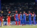 Royal Challengers Bengaluru's Virat Kohli interacts with Delhi Capitals players Royal Challengers Bengaluru's Virat Kohli interacts with Delhi Capitals players