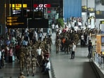 CISF personnel participate in the civil defence security mock drill at the Indira Gandhi International Airport in New Delhi.