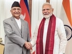 Prime Minister Narendra Modi (R) shaking hands with his Nepal's counterpart KP Sharma Oli Prime Minister Narendra Modi (R) shaking hands with his Nepal's counterpart KP Sharma Oli