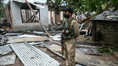 A security personnel stands next to a house destroyed by Pakistani artillery shelling at the Salamabad village in Uri, about 110kms from Srinagar on Thursday. (AFP) A security personnel stands next to a house destroyed by Pakistani artillery shelling at the Salamabad village in Uri, about 110kms from Srinagar on Thursday. (AFP)