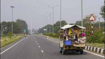 A tempo plying on the Attari-Wagah road amid rise in tension between India and Pakistan, in Amritsar district on Friday. A complete blackout was enforced in the border districts on Thursday night and power supply was restored at 5.30am on Friday. (PTI Photo)