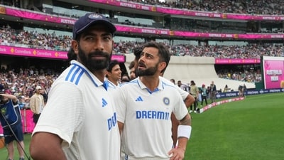 India's Jasprit Bumrah, left, and teammate Virat Kohli (AP) India's Jasprit Bumrah, left, and teammate Virat Kohli (AP)