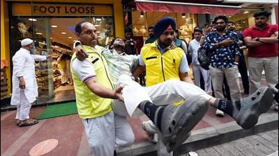 Delhi Civil Defence personnel and others in a shop during 'Operation Abhyaas' at Khan Market on May 7. (Arvind Yadav/HT PHOTO) Delhi Civil Defence personnel and others in a shop during 'Operation Abhyaas' at Khan Market on May 7. (Arvind Yadav/HT PHOTO)