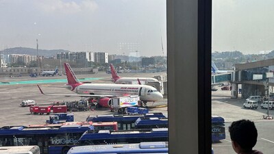 A boy looks at Air India airline passenger aircrafts parked at the Chhatrapati Shivaji Maharaj International Airport in Mumbai. (File photo) (REUTERS)