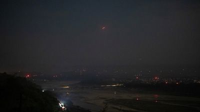 India's air defence system intercepts objects in the sky during a blackout following multiple blasts in the city of Jammu. (Adnan Abidi/REUTERS)