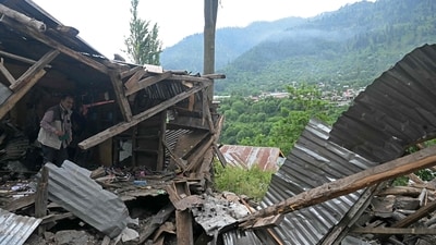 A local resident inspects the debris of his house that was destroyed by Pakistani artillery shelling at the Lagama village in Uri. (AFP) A local resident inspects the debris of his house that was destroyed by Pakistani artillery shelling at the Lagama village in Uri. (AFP)