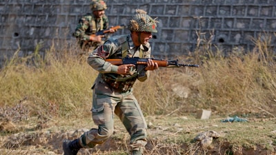 Indian army soldiers during a search operation in a forest area outside the Pathankot air force base in Pathankot. (AP) Indian army soldiers during a search operation in a forest area outside the Pathankot air force base in Pathankot. (AP)