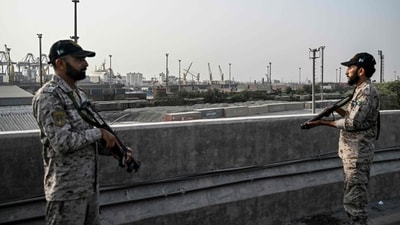 Security personnel stands guard near the Karachi Port in Karachi on May 9, 2025, amid the ongoing border tensions between India and Pakistan. (AFP) Security personnel stands guard near the Karachi Port in Karachi on May 9, 2025, amid the ongoing border tensions between India and Pakistan. (AFP)