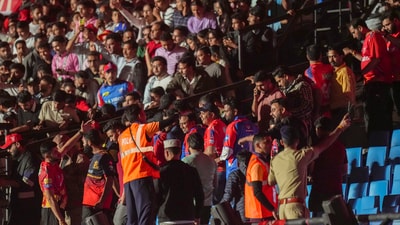 IPL officials and HPCA Stadium security evacuating the cricket ground after a blackout caused play to be abandoned in Dharamsala. (PTI) IPL officials and HPCA Stadium security evacuating the cricket ground after a blackout caused play to be abandoned in Dharamsala. (PTI)