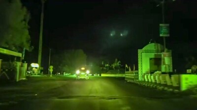 A vehicle moves on a road during blackout amid escalating tensions between India and Pakistan, in Kutch district, Gujarat. (PTI) A vehicle moves on a road during blackout amid escalating tensions between India and Pakistan, in Kutch district, Gujarat. (PTI)